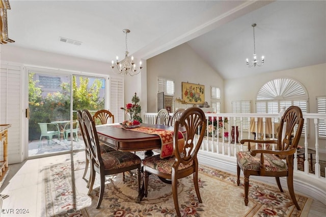 dining room featuring high vaulted ceiling and a notable chandelier