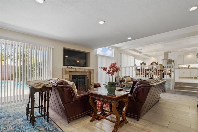 4416 Lilac Glen Dr, Las Vegas, NV 89129 - living area with plenty of natural light, a tile fireplace, recessed lighting, and a textured ceiling