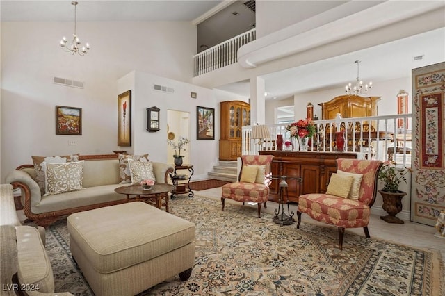 living room with a high ceiling and a notable chandelier