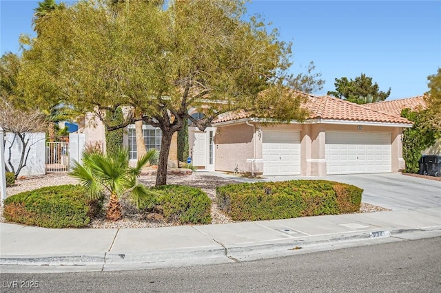 obstructed view of property featuring stucco siding, fence, concrete driveway, an attached garage, and a tiled roof