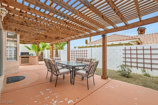 view of patio with outdoor dining space, exterior kitchen, a fenced backyard, and a pergola