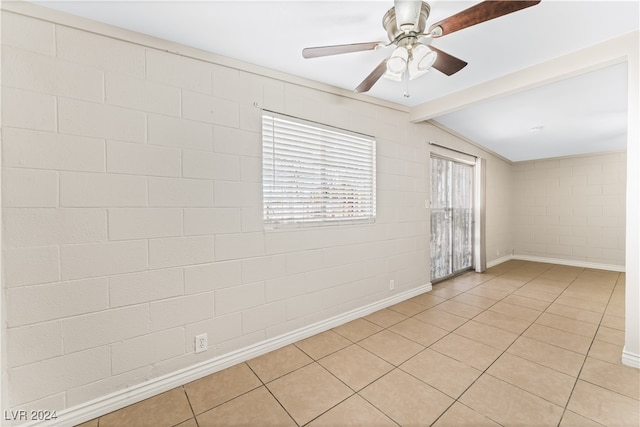 tiled empty room featuring vaulted ceiling with beams and ceiling fan