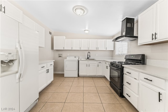 kitchen featuring gas stove, extractor fan, white refrigerator with ice dispenser, white cabinets, and washer / clothes dryer