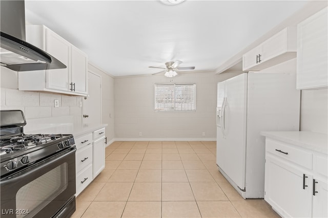 kitchen with white refrigerator with ice dispenser, white cabinets, wall chimney range hood, ceiling fan, and black gas range oven