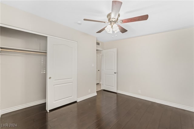 unfurnished bedroom featuring a closet, ceiling fan, and dark wood-type flooring