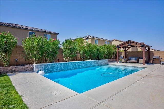 view of swimming pool with outdoor lounge area, a gazebo, and a patio