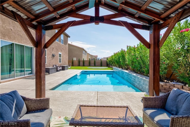 view of pool with an outdoor living space and a patio