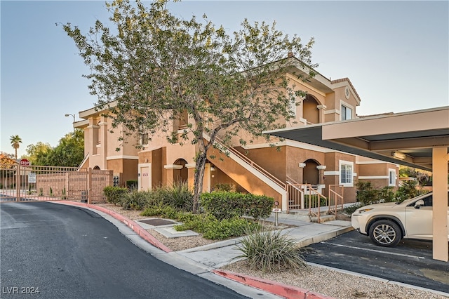 view of property featuring a carport