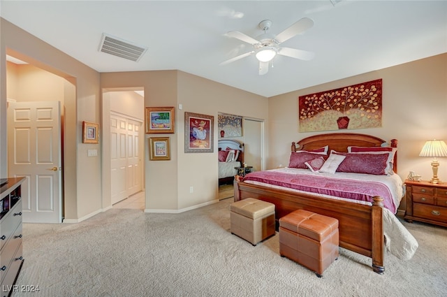 bedroom featuring light colored carpet and ceiling fan