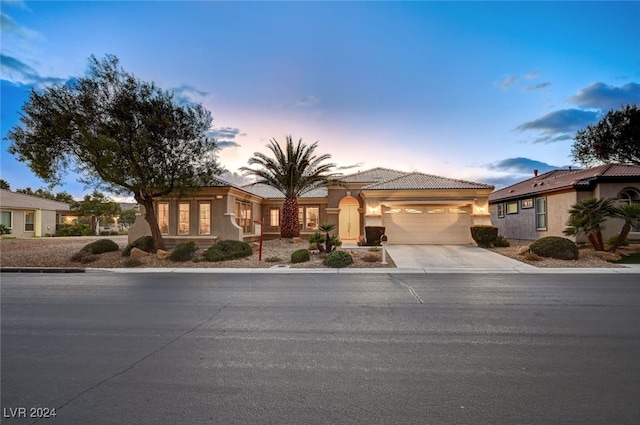 mediterranean / spanish-style house featuring a garage