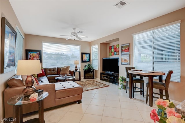 living room with ceiling fan and light tile patterned flooring