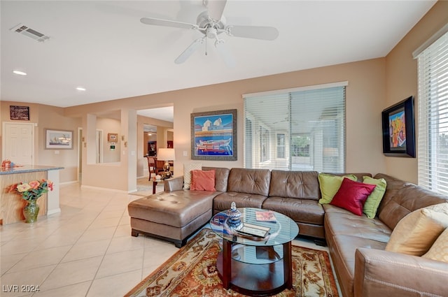 tiled living room featuring ceiling fan