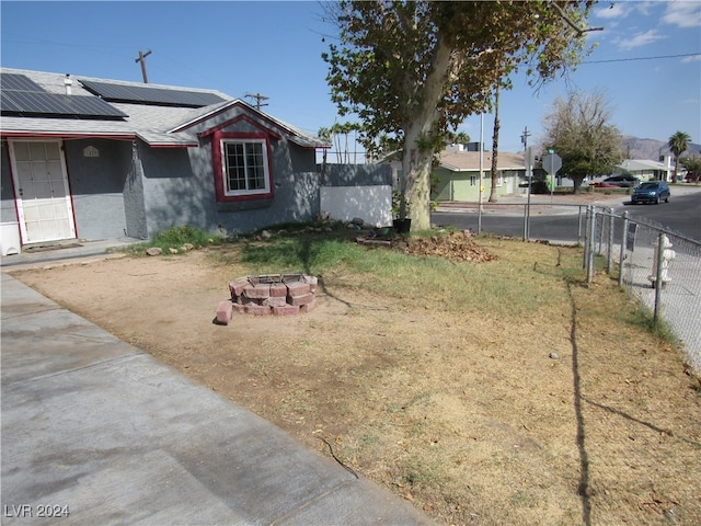 view of yard with a fire pit