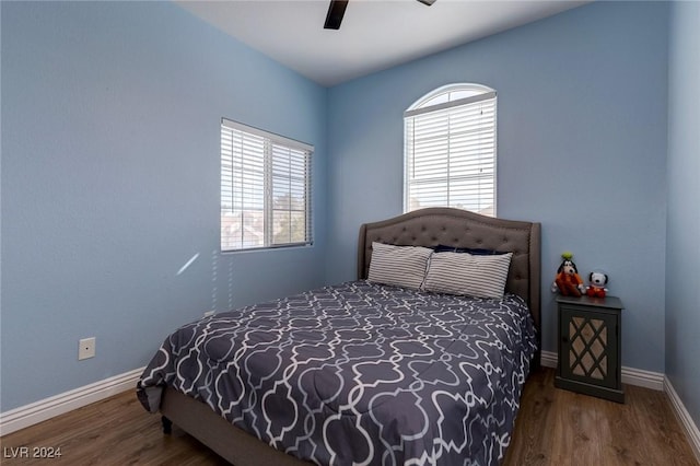 bedroom with ceiling fan and hardwood / wood-style flooring