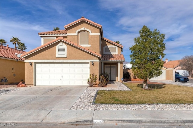 view of front of home with a front yard and a garage