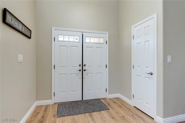 entryway with light hardwood / wood-style floors