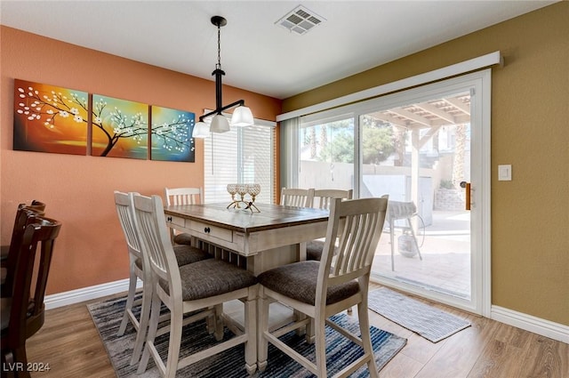 dining room with hardwood / wood-style flooring