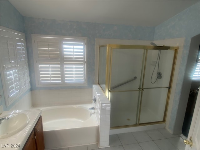 bathroom featuring plus walk in shower, tile patterned floors, and vanity