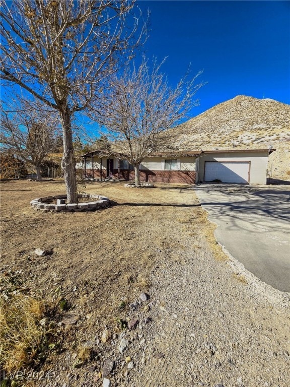 view of front of house with a mountain view and a garage