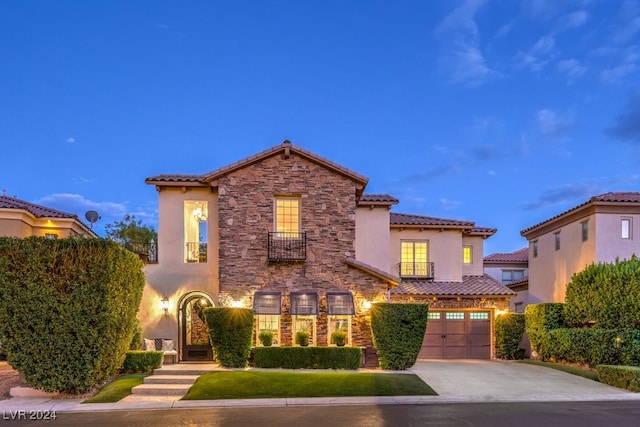 mediterranean / spanish house featuring a garage