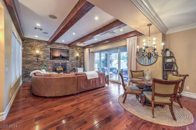 living room featuring crown molding, a fireplace, beamed ceiling, a notable chandelier, and dark hardwood / wood-style flooring