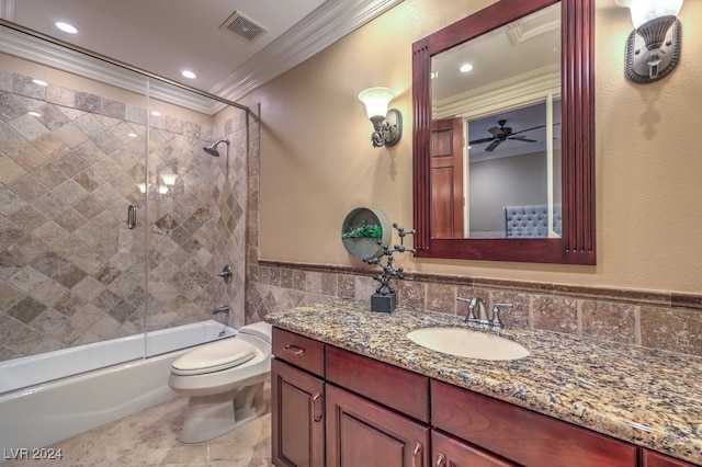 full bathroom featuring vanity, ceiling fan, crown molding, enclosed tub / shower combo, and toilet