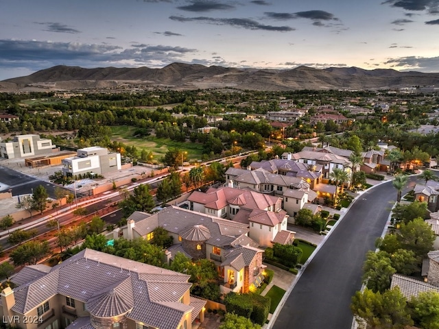 aerial view at dusk with a mountain view