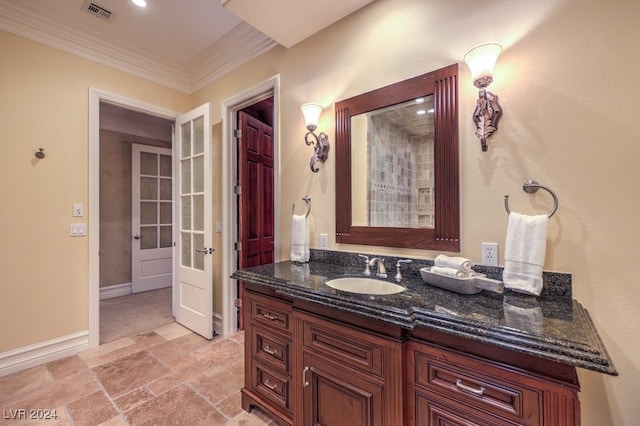 bathroom featuring vanity and crown molding