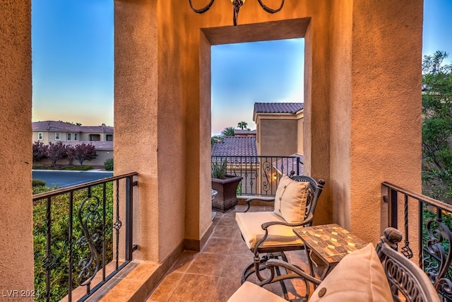 view of balcony at dusk