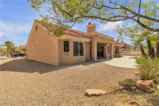 back of house featuring a patio area