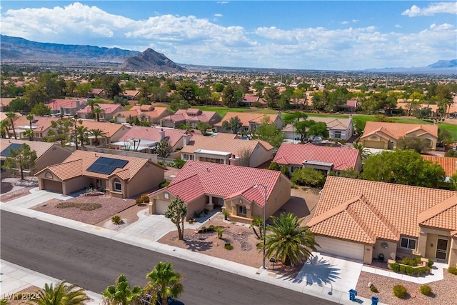 birds eye view of property featuring a mountain view