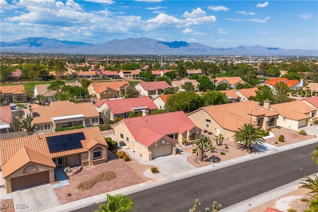 birds eye view of property with a mountain view