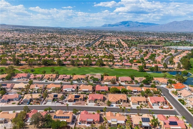 birds eye view of property with a mountain view