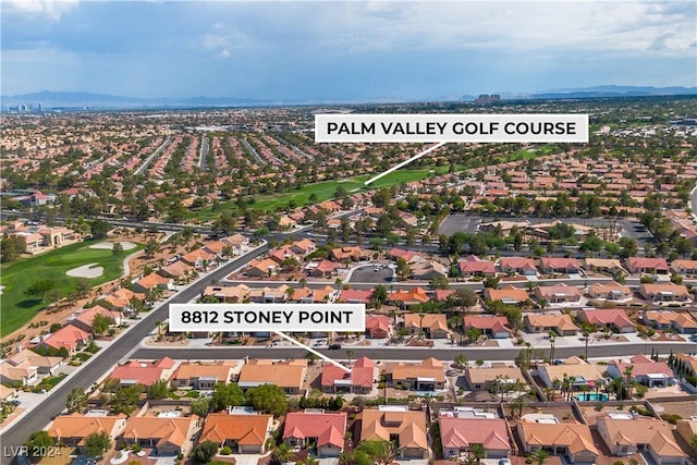 birds eye view of property with a mountain view