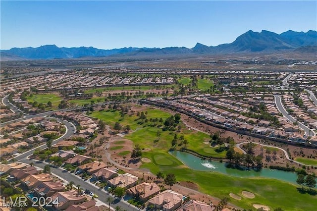 birds eye view of property featuring a water and mountain view