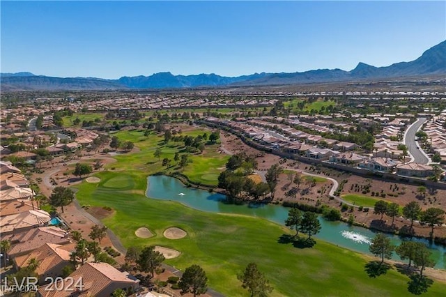 drone / aerial view with a water and mountain view