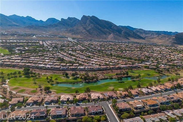 bird's eye view with a water and mountain view