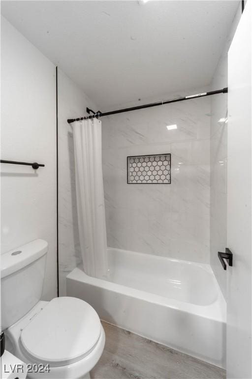 4724 Nara Vista Way Unit 204, Las Vegas, NV 89103 - full bath featuring shower / bath combo with shower curtain, toilet, and wood finished floors