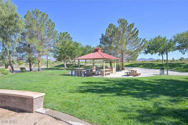 view of home's community with a yard and a gazebo