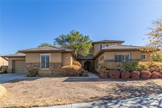 prairie-style house featuring a garage