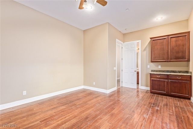 kitchen with light wood-type flooring and ceiling fan