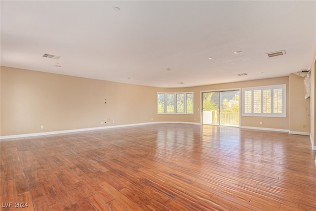 spare room with light hardwood / wood-style floors