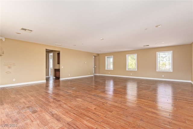 spare room featuring light hardwood / wood-style floors