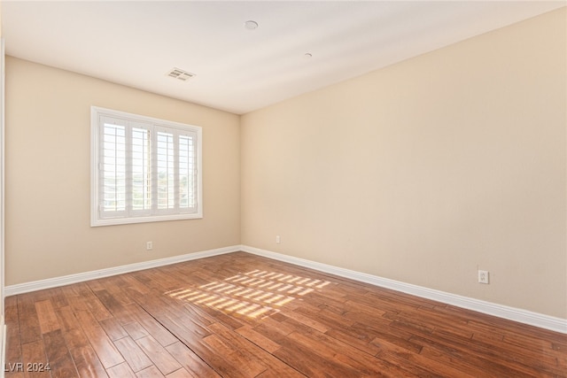 spare room featuring hardwood / wood-style flooring