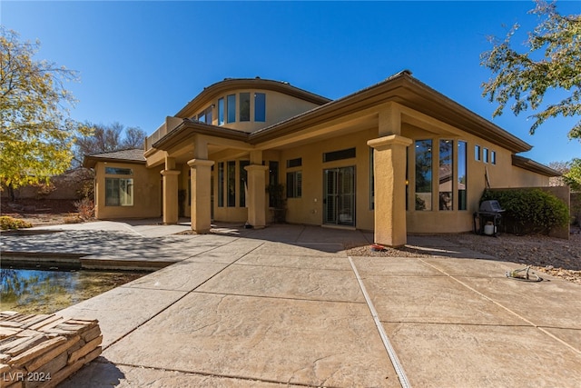 rear view of property with a patio area