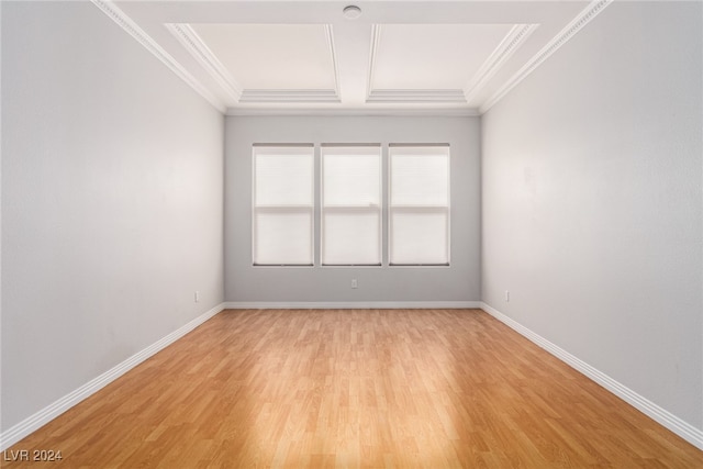 unfurnished room with light hardwood / wood-style floors and crown molding