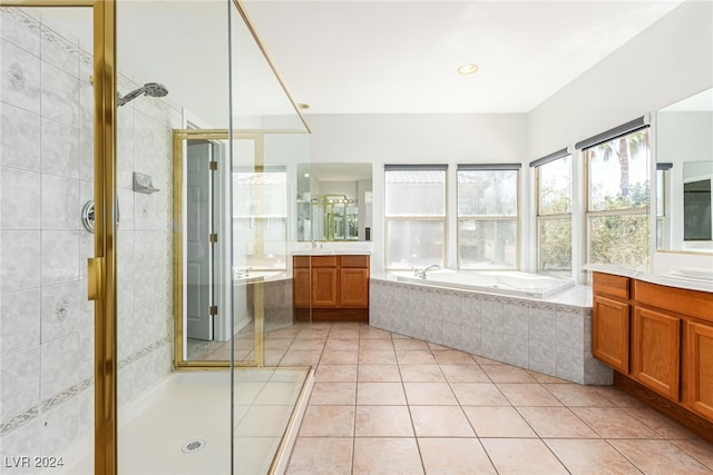 bathroom featuring tile patterned flooring, vanity, and independent shower and bath