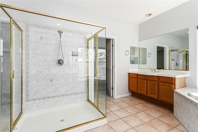 bathroom featuring vanity, tile patterned floors, and a shower with door