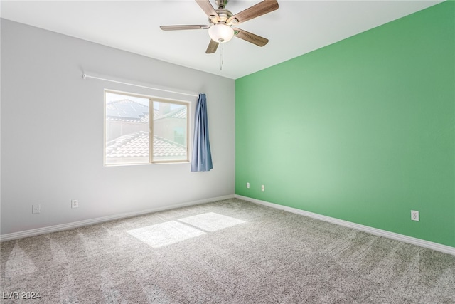 carpeted empty room with ceiling fan