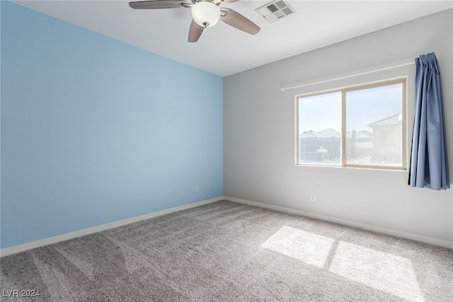 carpeted empty room with ceiling fan